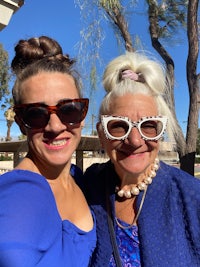 two women in sunglasses posing for a photo